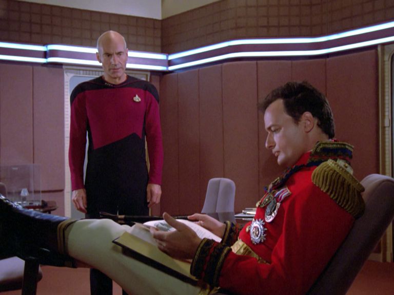 Captain Picard and Q in Picard's ready room, discussing Shakespeare